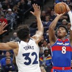 
              Washington Wizards forward Rui Hachimura (8) shoots over Minnesota Timberwolves center Karl-Anthony Towns (32) during the fourth quarter of an NBA basketball game Tuesday, April 5, 2022, in Minneapolis. The Wizards won 132-114. (AP Photo/Bruce Kluckhohn)
            