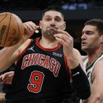 
              Milwaukee Bucks' Brook Lopez knocks the ball from Chicago Bulls' Nikola Vucevic during the second half of Game 1 of their first round NBA playoff basketball game Sunday, April 17, 2022, in Milwaukee. The Bucks won 93-86 to take a 1-0 lead in the series. (AP Photo/Morry Gash)
            