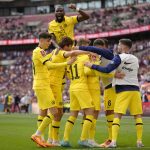 
              Chelsea players celebrate after Mason Mount scored their second goal during the English FA Cup semifinal soccer match between Chelsea and Crystal Palace at Wembley stadium in London, Sunday, April 17, 2022. (AP Photo/Kirsty Wigglesworth)
            