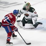 
              Montreal Canadiens' Brendan Gallagher (11) is stopped by Minnesota Wild goaltender Cam Talbot (33) during the second period of an NHL hockey game Tuesday, April 19, 2022, in Montreal. (Ryan Remiorz/The Canadian Press via AP)
            