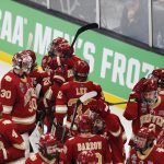 
              Denver players celebrate after defeating Michigan in overtime during an NCAA men's Frozen Four semifinal hockey game, Thursday, April 7, 2022, in Boston. (AP Photo/Michael Dwyer)
            