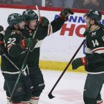 Minnesota Wild center Joel Eriksson Ek (14) looks to teammates after scoring a goal against the Seattle Kraken during the first period of an NHL hockey game, Friday, April 22, 2022, in St. Paul, Minn. (AP Photo/Stacy Bengs)