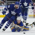 
              Toronto Maple Leafs defenseman TJ Brodie (78) drives past Buffalo Sabres forward Jeff Skinner (53) during the second period of an NHL hockey game Tuesday, April 12, 2022, in Toronto. (Nathan Denette/The Canadian Press via AP)
            