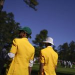 
              Spectators walk along the seventh fairway during the final round at the Masters golf tournament on Sunday, April 10, 2022, in Augusta, Ga. (AP Photo/Jae C. Hong)
            