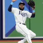 
              Tampa Bay Rays right fielder Manuel Margot has a triple by Seattle Mariners' Eugenio Suarez bounce over his head during the first inning of a baseball game Thursday, April 28, 2022, in St. Petersburg, Fla. (AP Photo/Chris O'Meara)
            