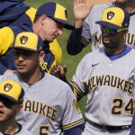 
              Milwaukee Brewers' Andrew McCutchen (24) celebrates with manager Craig Counsell, upper left, and teammates, after a 3-2 win over the Pittsburgh Pirates in a baseball game in Pittsburgh, Thursday, April 28, 2022. (AP Photo/Gene J. Puskar)
            
