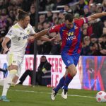 
              Leeds United's Luke Ayling, left, and Crystal Palace's James McArthur battle for the ball during the English Premier League soccer match between Crystal Palace and Leeds United at Selhurst Park, London, Monday April 25, 2022. (John Walton/PA via AP)
            
