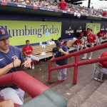 
              Boston Red Sox hitting coach Peter Fatse (62) watches the warmup in the fourth inning from the dugout during a spring training baseball game against the Atlanta Braves at CoolToday Park, Sunday, April 3, 2022, in North Port, Fla. (AP Photo/Steve Helber)
            