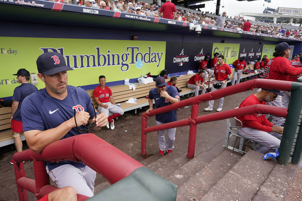 Boston Red Sox hitting coach Peter Fatse (62) watches the warmup in the fourth inning from the dugo...
