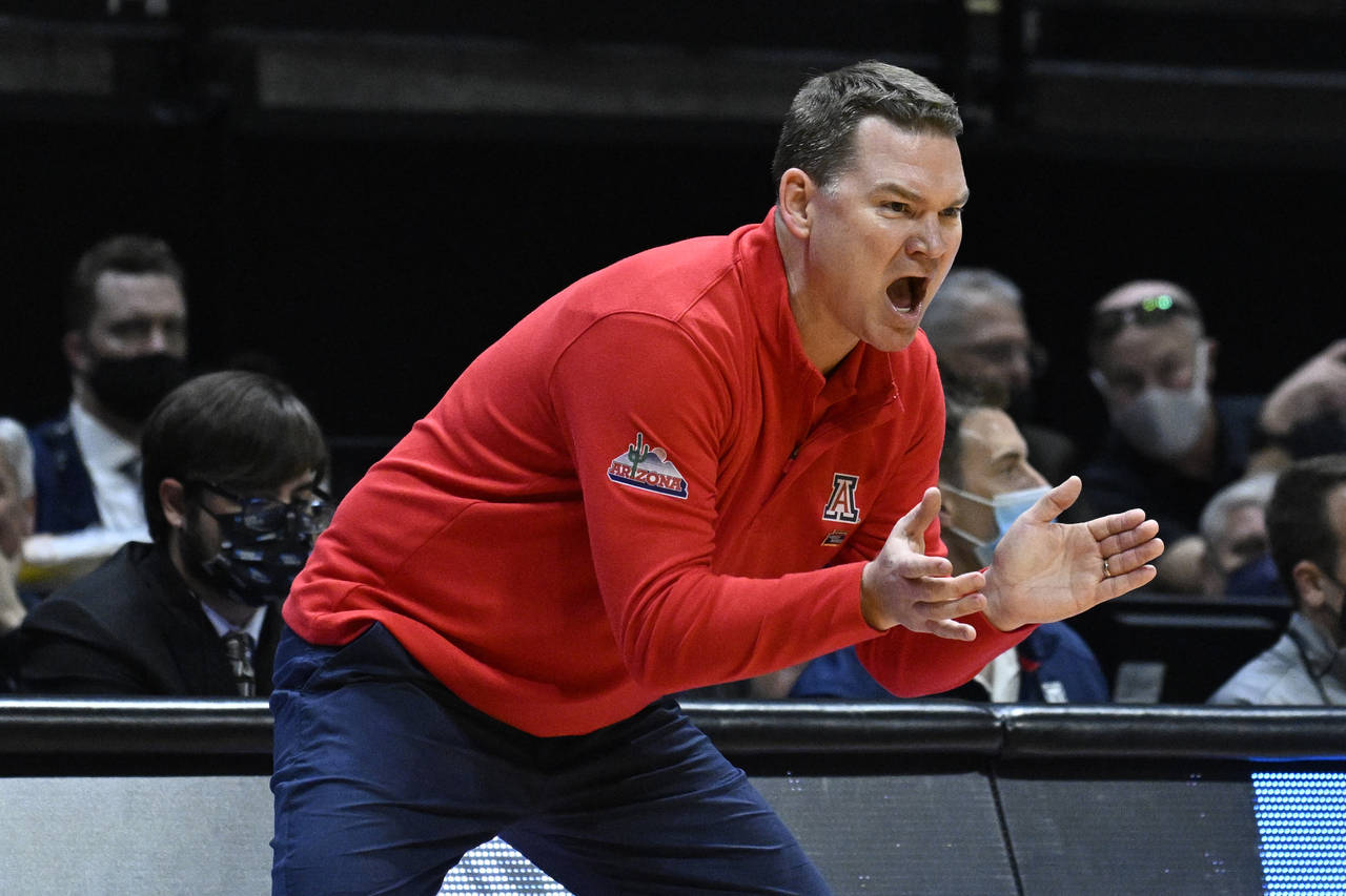 Arizona head coach Tommy Lloyd calls to his team during the first half of a second-round NCAA colle...
