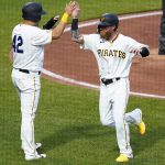 
              Pittsburgh Pirates' Ben Gamel, right, is greeted by Yoshi Tsutsugo after they scored on a hit by Hoy Park during the second inning of the team's baseball game against the Washington Nationals, Friday, April 15, 2022, in Pittsburgh. (AP Photo/Keith Srakocic)
            