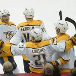 
              Nashville Predators' Nick Cousins (21) celebrates with teammates after scoring against the Pittsburgh Penguins during the third period of an NHL hockey game, Sunday, April 10, 2022, in Pittsburgh. The Penguins won 3-2 in overtime. (AP Photo/Keith Srakocic)
            
