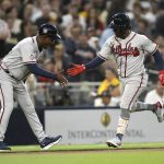
              Atlanta Braves' Ozzie Albies, right, celebrates his home run with third base coach Ron Washington during the third inning of a baseball game against the San Diego Padres in San Diego, Friday, April 15, 2022. (AP Photo/Kyusung Gong)
            