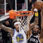 
              FILE - Brooklyn Nets forward Kevin Durant (7) shoots as Golden State Warriors forward Kelly Oubre Jr., (12) defends during the first quarter of an opening night NBA basketball game, Dec. 22, 2020, in New York. (AP Photo/Kathy Willens, File)
            