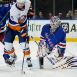 
              New York Rangers goaltender Igor Shesterkin (31) makes a save against New York Islanders right wing Oliver Wahlstrom (26) during the first period of an NHL hockey game, Friday, April 1, 2022, in New York. (AP Photo/John Minchillo)
            