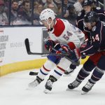 
              Montreal Canadiens' Jordan Harris, left, and Columbus Blue Jackets' Gustav Nyquist chase the puck during the second period of an NHL hockey game Wednesday, April 13, 2022, in Columbus, Ohio. (AP Photo/Jay LaPrete)
            