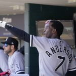 
              Chicago White Sox shortstop Tim Anderson talks with left fielder Eloy Jimenez in the dugout during the fourth inning of a baseball game against the Detroit Tigers, Sunday, April 10, 2022, in Detroit. (AP Photo/Carlos Osorio)
            