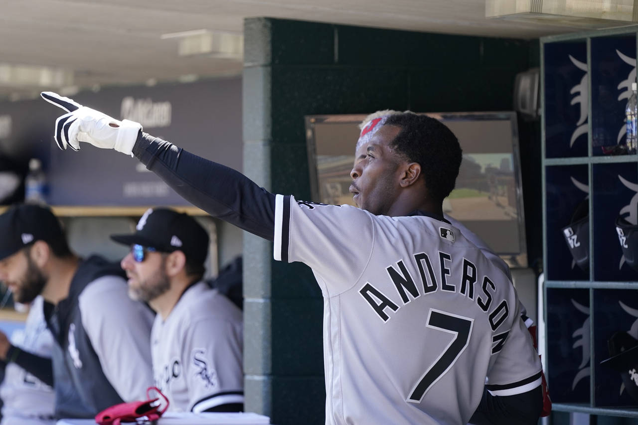 Chicago White Sox shortstop Tim Anderson talks with left fielder Eloy Jimenez in the dugout during ...