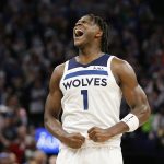 
              Minnesota Timberwolves forward Anthony Edwards celebrates during the fourth quarter of the team's NBA basketball game against the Los Angeles Clippers on Tuesday, April 12, 2022, in Minneapolis. (AP Photo/Andy Clayton-King)
            