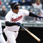 
              Cleveland Guardians' Josh Naylor hits an RBI single against the Chicago White Sox during the fifth inning of a baseball game, Thursday, April 21, 2022, in Cleveland. (AP Photo/Ron Schwane)
            
