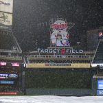 
              Heavy rain falls over Target Field as a weather delay is called during the eighth inning of a baseball game between the Los Angeles Dodgers and the Minnesota Twins on Tuesday, April 12, 2022, in Minneapolis. (AP Photo/Nicole Neri)
            