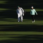 
              Takumi Kanaya, of Japan, walks with his caddie Gareth Kenneth Johnstone on the second fairway during the second round at the Masters golf tournament on Friday, April 8, 2022, in Augusta, Ga. (AP Photo/Matt Slocum)
            