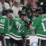 
              Dallas Stars' Marian Studenic (43), Tyler Seguin (91) and Jamie Benn (14) celebrate a goal scored by Seguin during the first period of the team's NHL hockey game against the New York Islanders, Tuesday, April 5, 2022, in Dallas. (AP Photo/Tony Gutierrez)
            