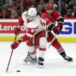 
              Detroit Red Wings left wing Tyler Bertuzzi (59) tries to evadeCarolina Hurricanes defenseman Ethan Bear (25) as he handles the puck during the first period of an NHL hockey game Thursday, April 14, 2022, in Raleigh, N.C. (AP Photo/Chris Seward)
            