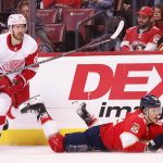 
              Florida Panthers defenseman Brandon Montour (62) is hit by Detroit Red Wings defenseman Jordan Oesterle (82) during the first period of an NHL hockey game Thursday, April 21, 2022, in Sunrise, Fla. (AP Photo/Reinhold Matay)
            