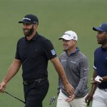 
              From left, Dustin Johnson, Brian Harman and Harold Varner III walk off the second green during a practice round for the Masters golf tournament on Tuesday, April 5, 2022, in Augusta, Ga. (AP Photo/Jae C. Hong)
            