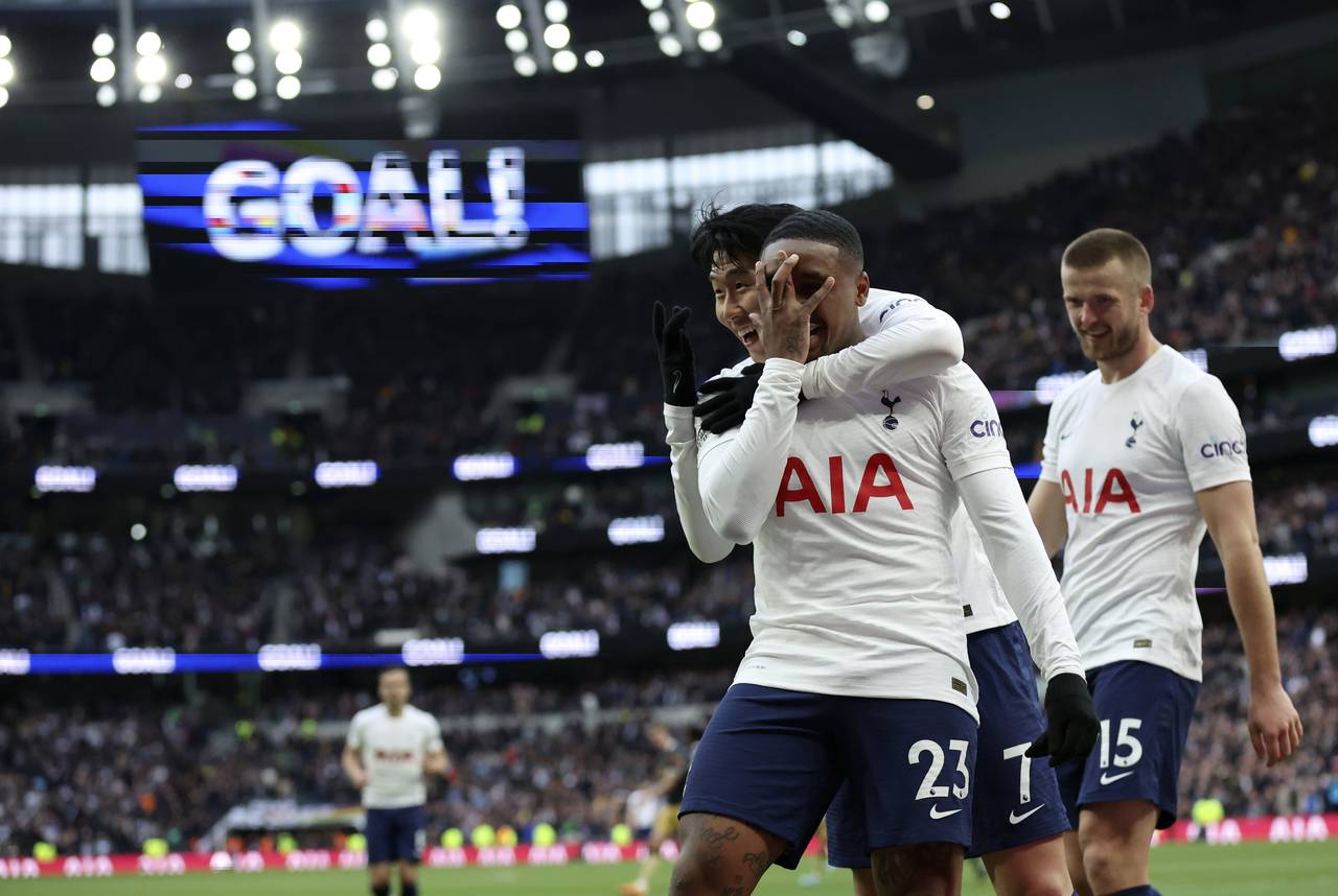 Tottenham's Steven Bergwijn, foreground, celebrates with Son Heung-min, after scoring his side's fi...