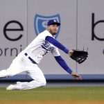 
              Los Angeles Dodgers center fielder Cody Bellinger makes a catch on a ball hit by Detroit Tigers' Jonathan Schoop during the seventh inning of a baseball game Friday, April 29, 2022, in Los Angeles. (AP Photo/Mark J. Terrill)
            