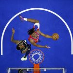 
              FILE - Philadelphia 76ers' Tyrese Maxey, right, goes up for a shot against Denver Nuggets' Monte Morris during the first half of an NBA basketball game, March 14, 2022, in Philadelphia. (AP Photo/Matt Slocum, File)
            