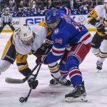 
              Pittsburgh Penguins center Jeff Carter (77) and New York Rangers center Andrew Copp (18) vie for the puck on a faceoff during the first period of an NHL hockey game Thursday, April 7, 2022, in New York. (AP Photo/Bebeto Matthews)
            