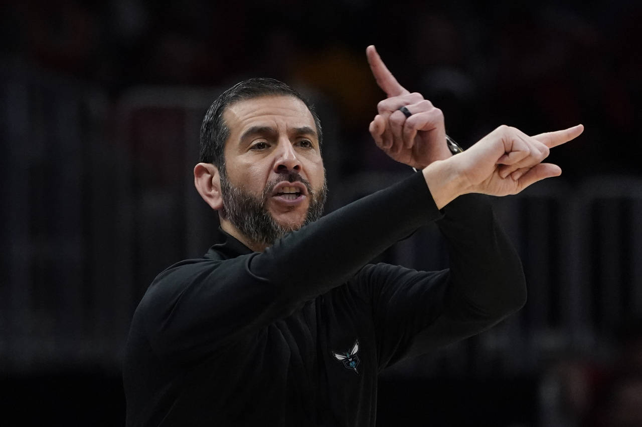 Charlotte Hornets head coach James Borrego gestures to players during the first half of the team's ...