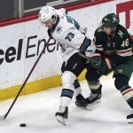 
              Minnesota Wild's Jared Spurgeon (46) attempts to slow up San Jose Sharks' Noah Gregor (73) in the first period of an NHL hockey game, Sunday, April 17, 2022, in St. Paul, Minn. (AP Photo/Jim Mone)
            
