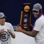 
              South Carolina head coach Dawn Staley and Aliyah Boston celebrate after a college basketball game in the final round of the Women's Final Four NCAA tournament against UConn Sunday, April 3, 2022, in Minneapolis. South Carolina won 64-49 to win the championship. (AP Photo/Charlie Neibergall)
            