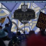 
              Fans cheer during the third round of the NFL football draft Friday, April 29, 2022, in Las Vegas. (AP Photo/Jae C. Hong)
            