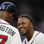 
              Atlanta Braves second baseman Ozzie Albies (1) laughs with third base coach Ron Washington (37) during the inning of a baseball game against the Chicago Cubs, Tuesday, April 26, 2022, in Atlanta. (AP Photo/Brynn Anderson)
            
