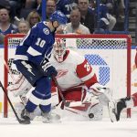 
              Detroit Red Wings goaltender Thomas Greiss (29) makes a save on a shot from Tampa Bay Lightning right wing Corey Perry (10) during the third period an NHL hockey game Tuesday, April 19, 2022, in Tampa, Fla. (AP Photo/Jason Behnken)
            