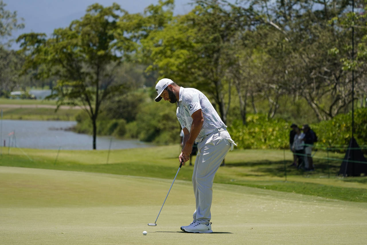 Jon Rahm, of Spain, putts on the sixth hole during the third round of the Mexico Open at Vidanta in...