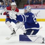
              Toronto Maple Leafs goaltender Erik Kallgren (50) makes a save as Montreal Canadiens center Rem Pitlick (32) looks for a rebound during the first period of an NHL hockey game in Toronto, Saturday, April 9, 2022. (Frank Gunn/The Canadian Press via AP)
            