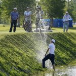 
              Brandon Hagy hits out of a water hazard on the 17th hole during the second round of the PGA Zurich Classic golf tournament, Friday, April 22, 2022, at TPC Louisiana in Avondale, La. (AP Photo/Gerald Herbert)
            