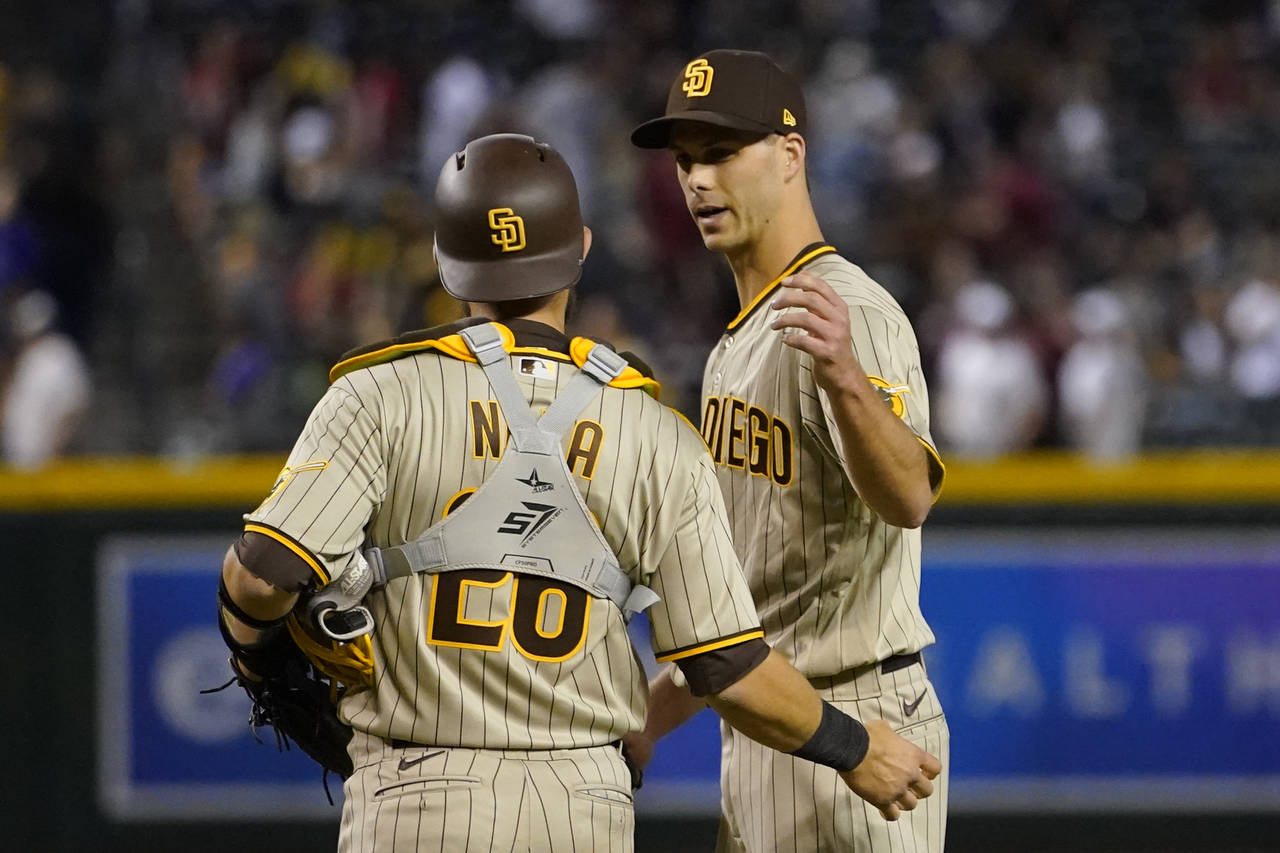 San Diego Padres relief pitcher Taylor Rogers and catcher Austin Nola celebrates after a baseball g...