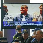 
              Seattle Seahawks fans watch as Georgia pass rusher Travon Walker is shown on a TV monitor as he is picked by the Jacksonville Jaguars as the top pick in the NFL football draft, Thursday, April 28, 2022, at a Seahawks draft day party in Renton, Wash., near Seattle. (AP Photo/Ted S. Warren)
            