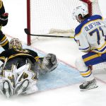 
              Boston Bruins goaltender Linus Ullmark, left, covers the puck as Buffalo Sabres left wing Victor Olofsson (71) looks for a rebound during the second period of an NHL hockey game, Thursday, April 28, 2022, in Boston. (AP Photo/Charles Krupa)
            