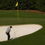 
              Charl Schwartzel, of South Africa, hits out of a bunker on the fourth hole during the second round at the Masters golf tournament on Friday, April 8, 2022, in Augusta, Ga. (AP Photo/Charlie Riedel)
            