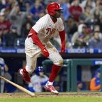 
              Philadelphia Phillies' Didi Gregorius (18) runs to first on an RBI double during the eighth inning of a baseball game against the New York Mets, Monday, April 11, 2022, in Philadelphia. (AP Photo/Laurence Kesterson)
            