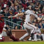 
              Arizona Diamondbacks' Cooper Hummel watches his RBI single during the sixth inning of a baseball game against the St. Louis Cardinals Friday, April 29, 2022, in St. Louis. (AP Photo/Jeff Roberson)
            