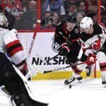 
              Ottawa Senators left wing Brady Tkachuk (7) battles for the puck with New Jersey Devils defenseman Damon Severson (28) during the second period of an NHL hockey game in Ottawa, on Tuesday, April 26, 2022. (Justin Tang/The Canadian Press via AP)
            